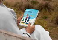 Close-up of a person holding Neuro Surge educational material for mental clarity